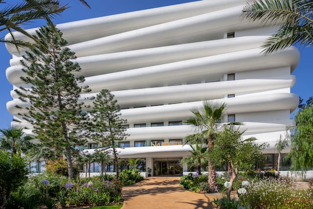 Hotel Exterior with Trees Around a Pathway