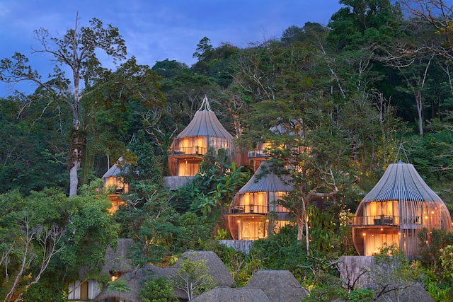 Exterior of Tree Pool Houses in the Evening