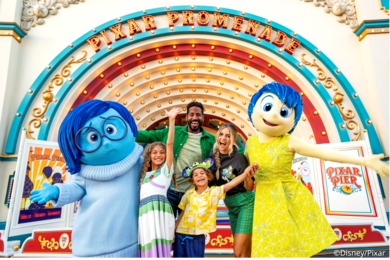 Family with Disney characters at Pixar Pier