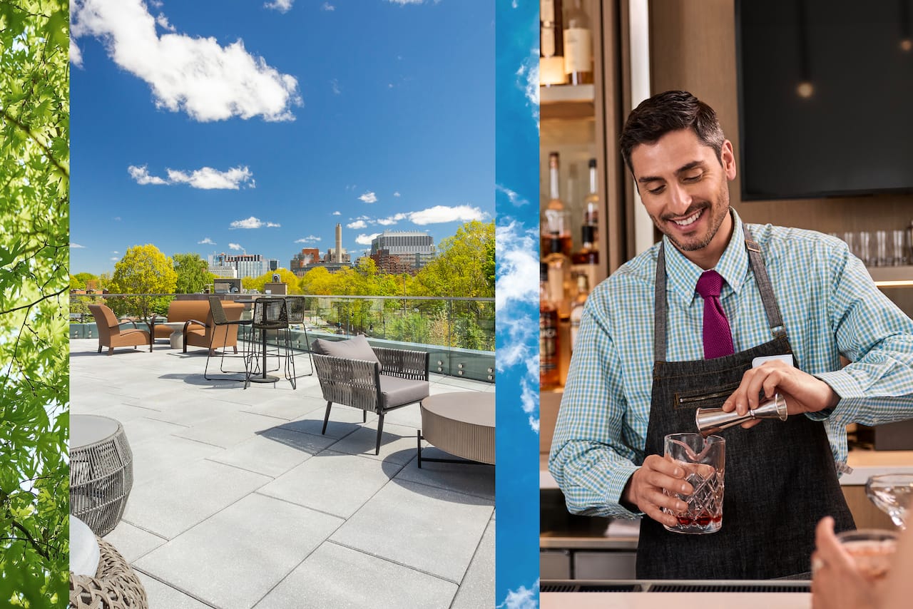 A bartender preparing a drink with phenomenal views from the roof deck terrace at Hilton Garden Inn Boston Brookline.  