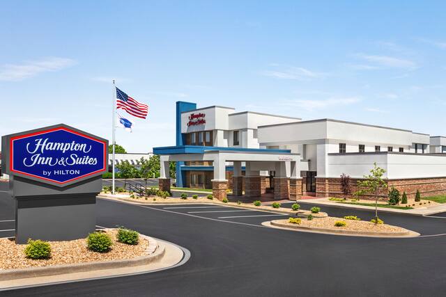 Hotel exterior with spacious parking lot for convenient guest access